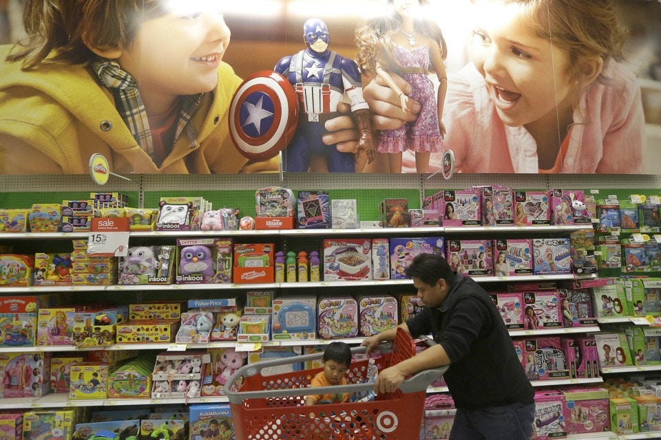 father and son shopping in toystore