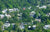 top view image of group of houses among the trees 