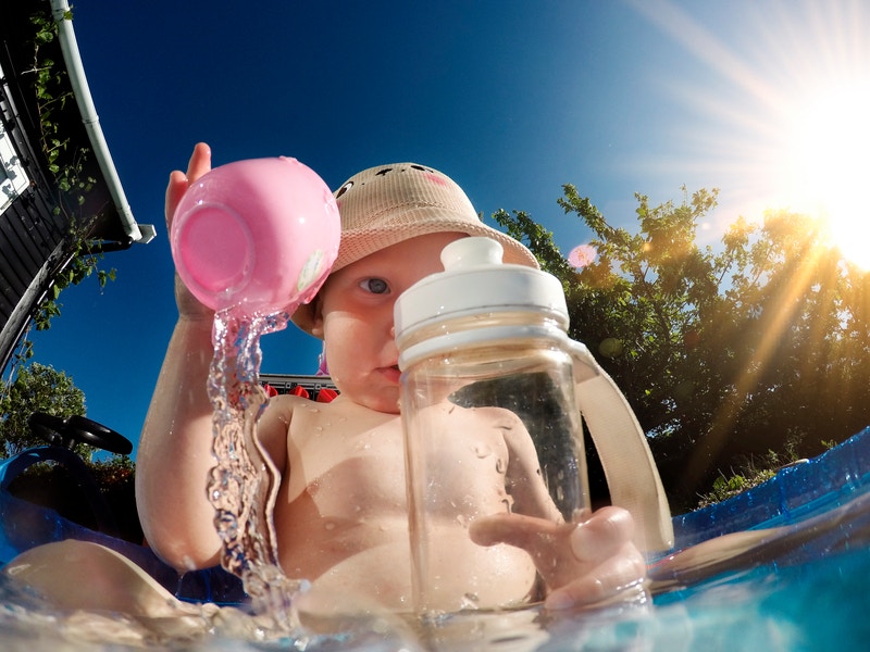 kid playing with water