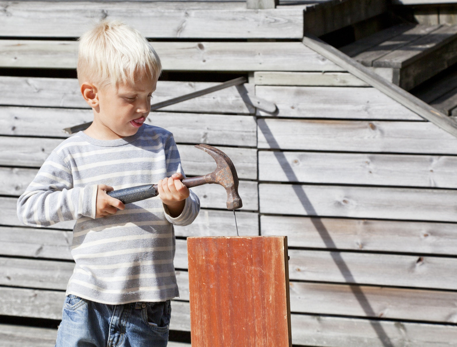 boy hammering wood