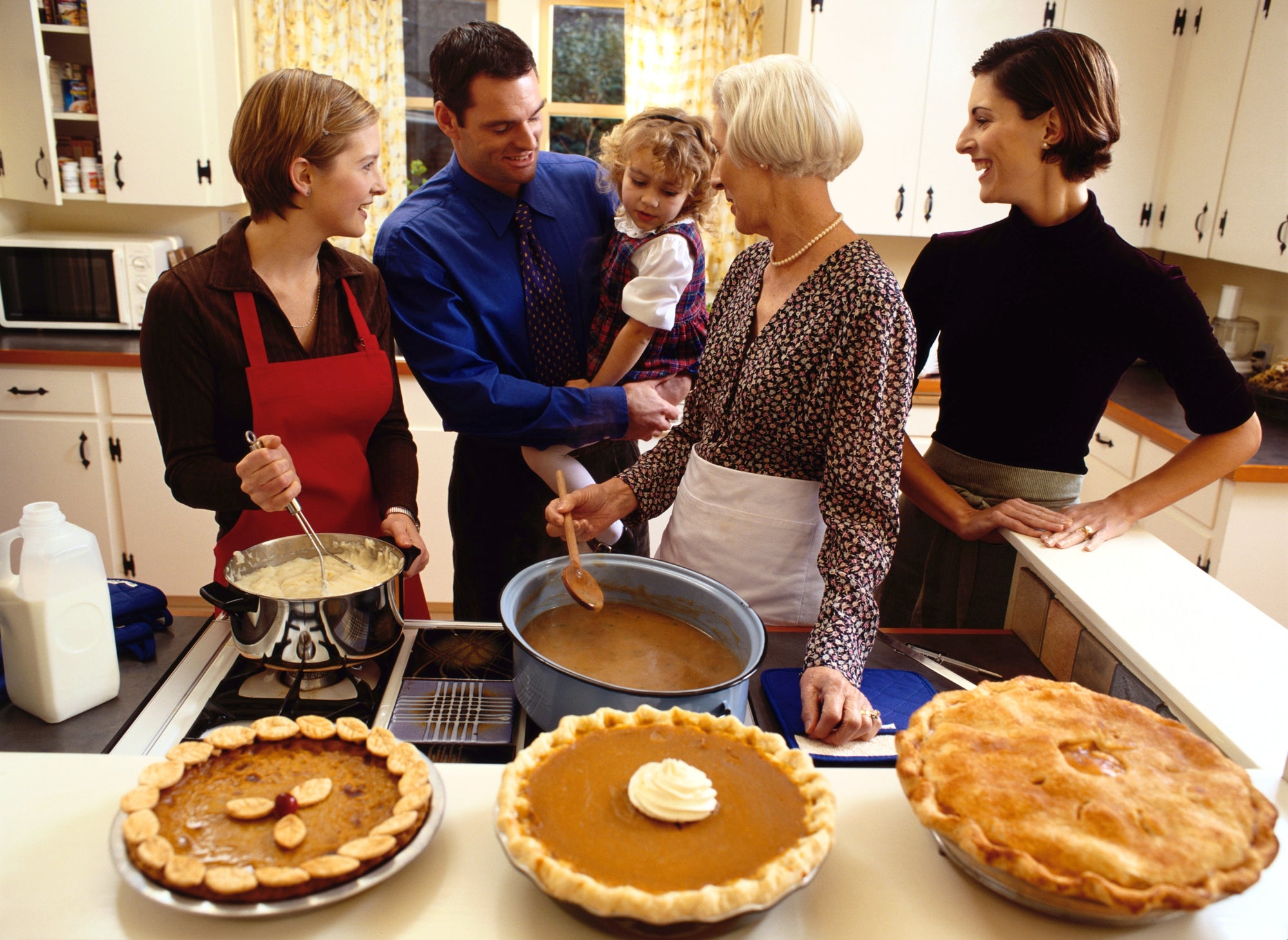 family having fun in the kitchen