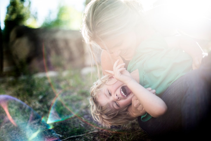 Mother Playing With Her Little Baby Daughter Girl On Sunshine