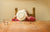 Child finishing food, cleaning plate using tongue, hiding face