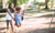 girl playing on a swing