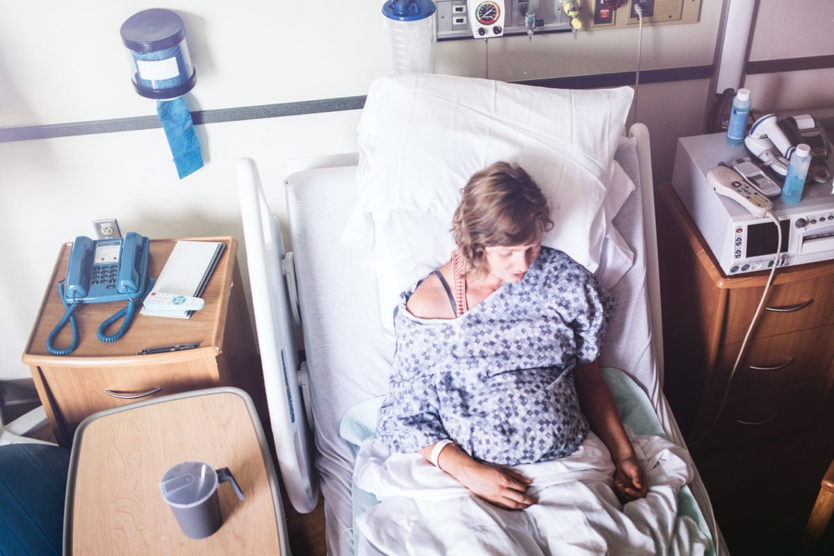 pregnant women on a bed in the hospital room