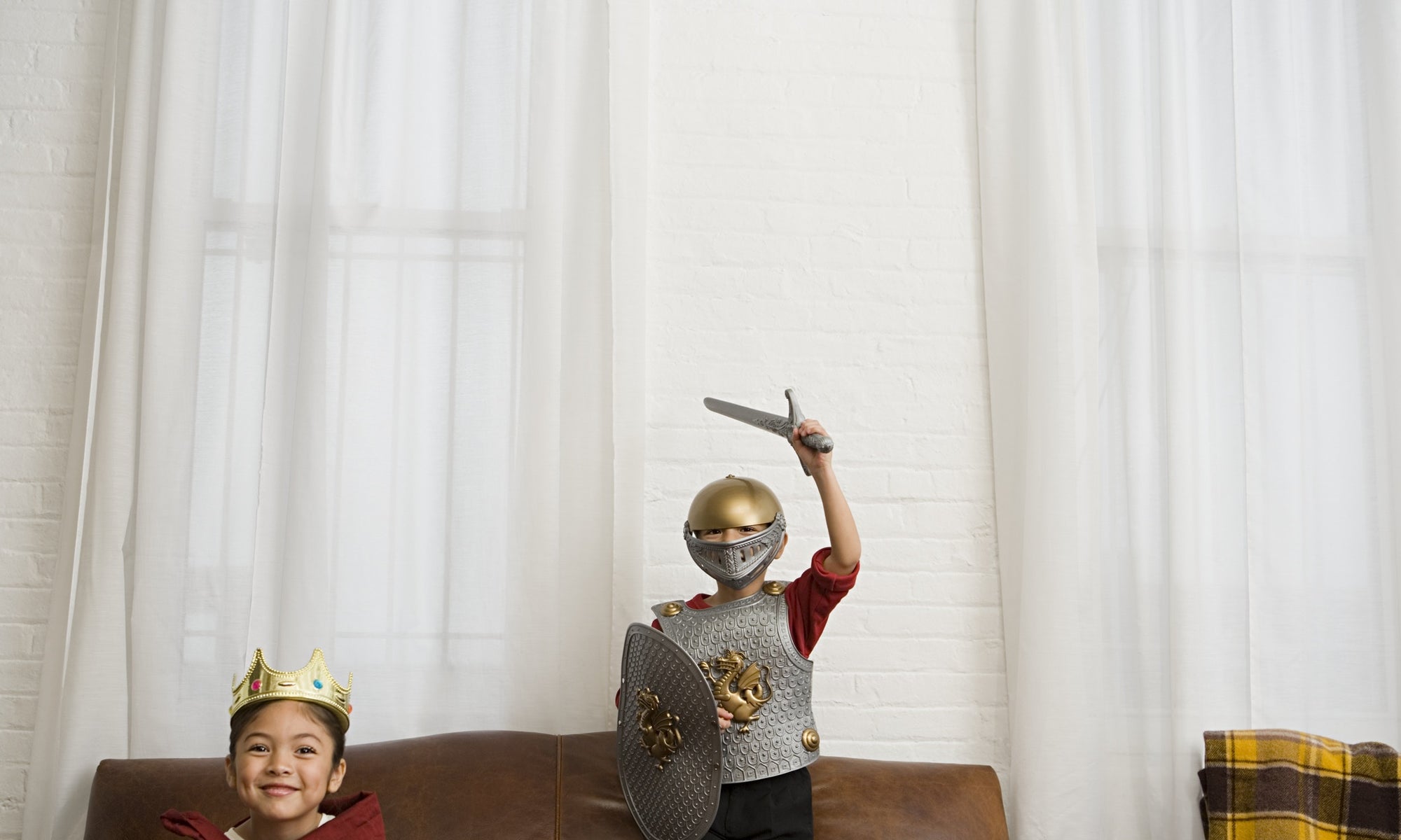 Boys in knight costume in living room