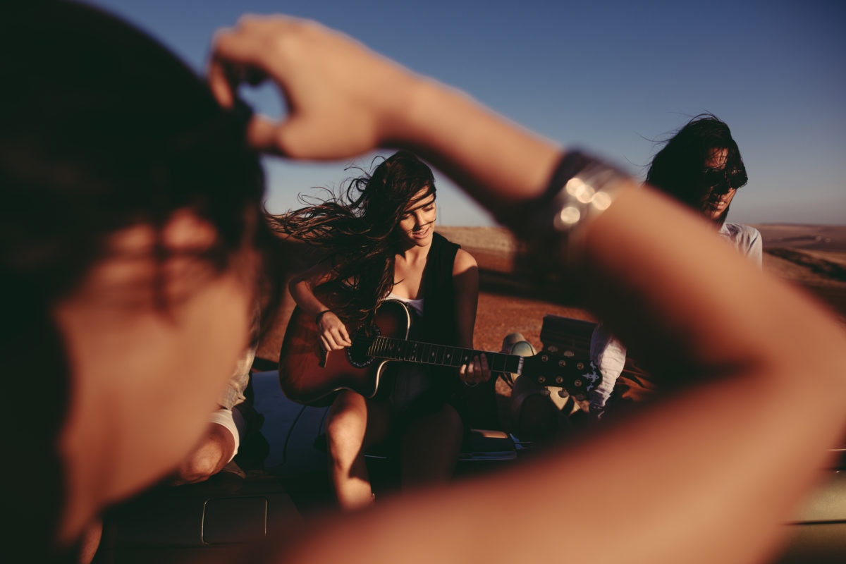 young lady playing guitar