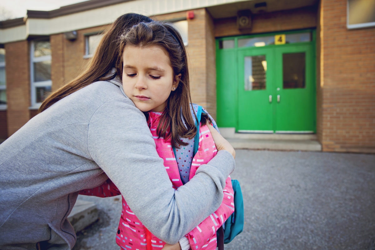 mother sends her child to school