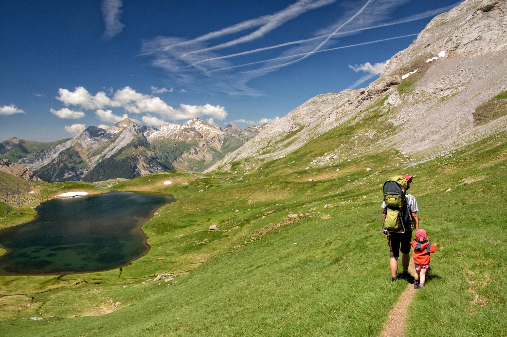 Mother and her kid going for a mountain hiking