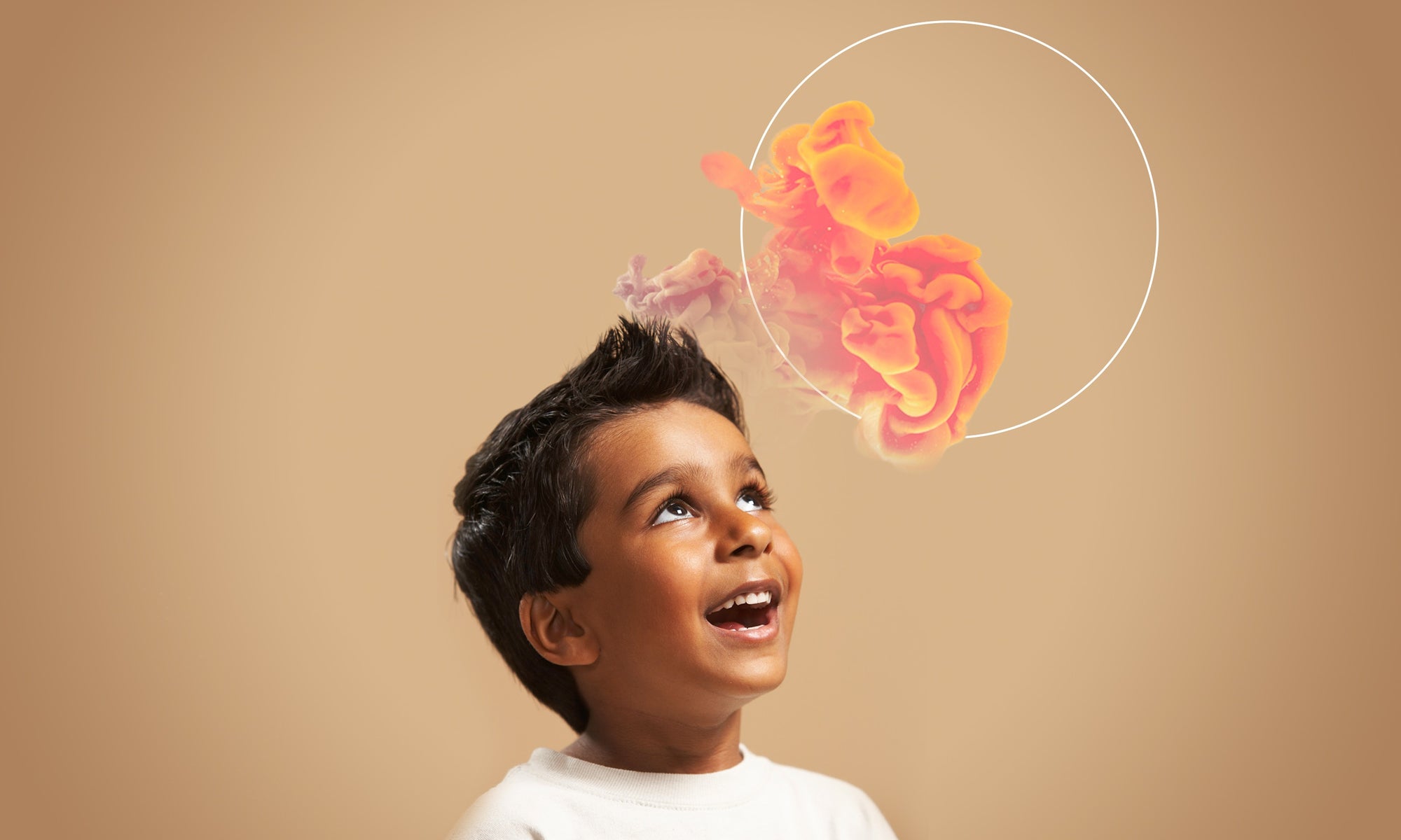 little boy looking upwards and smiling