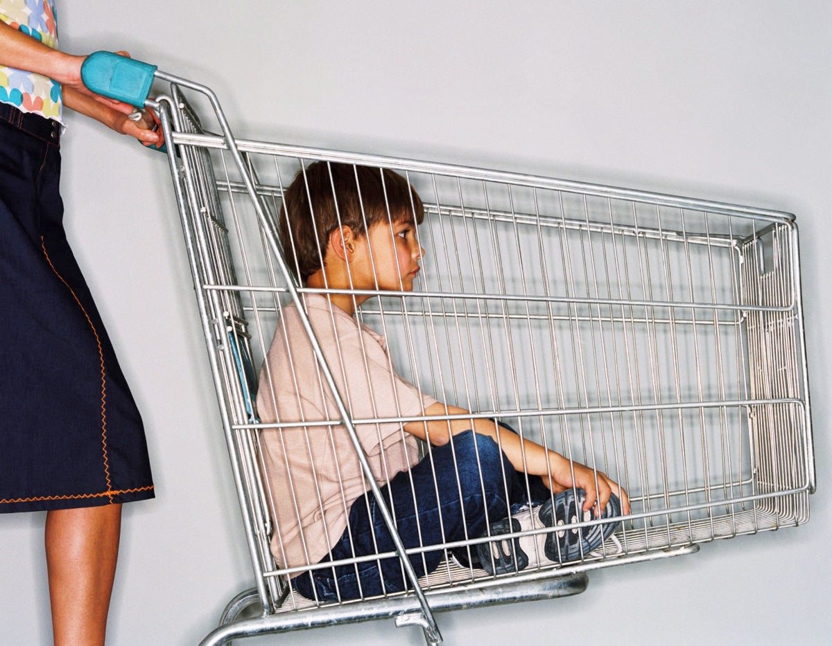 woman with a child in a shopping car