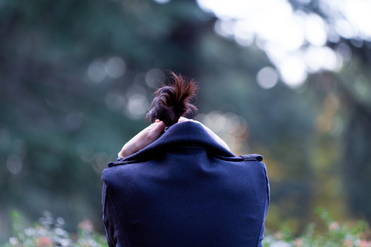 rear view of a stressed lady