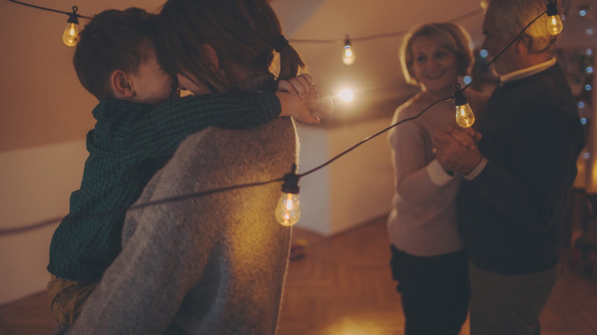 Old couple enjoying party by seeing kids