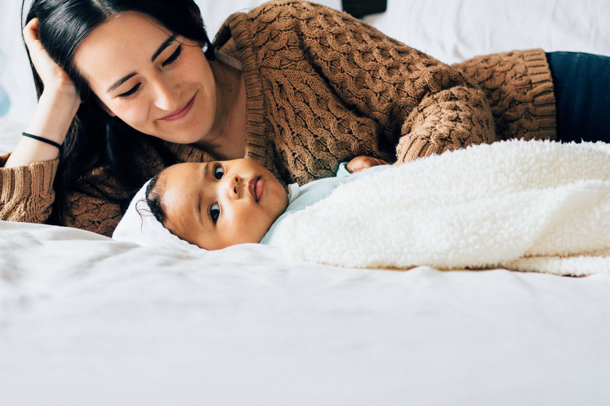 Mother is watching her kid sleeping