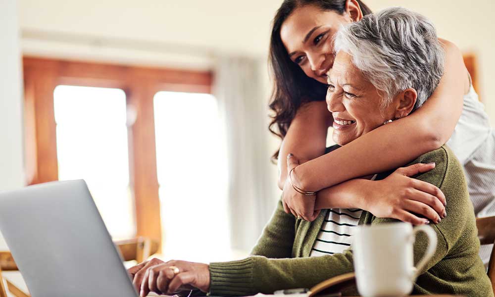 adults looking at a computer