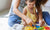 mother and daughter playing with toy on floor