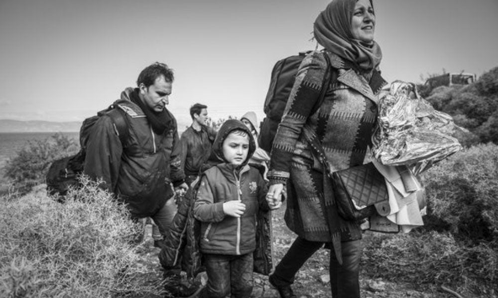 sad mother holding a hand of this son walking