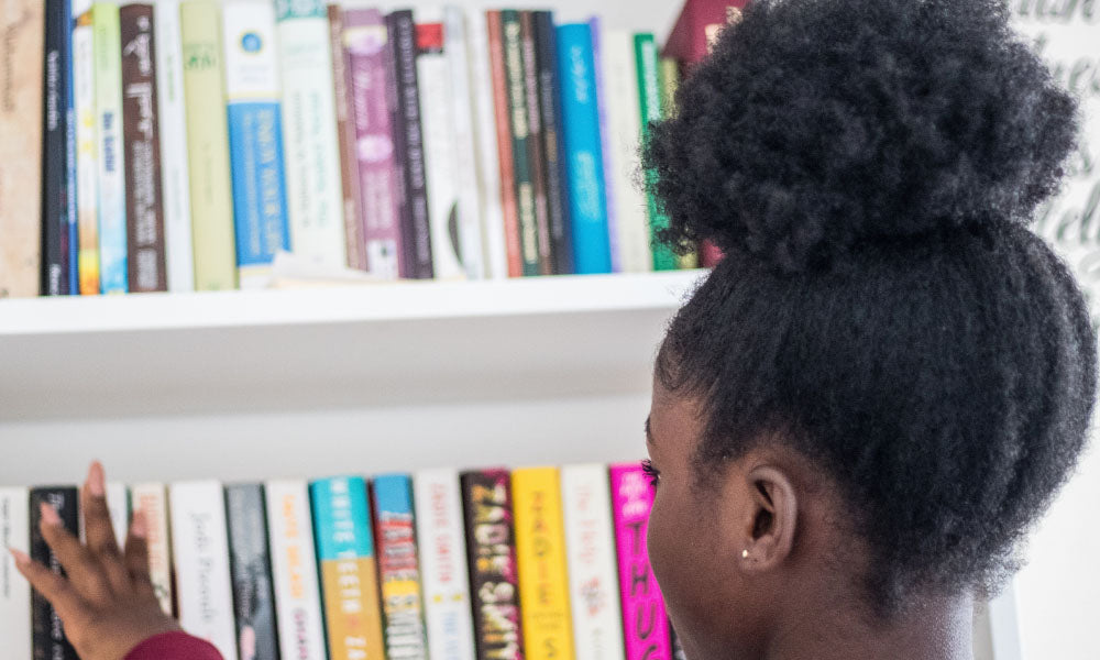 girl browsing a bookshelf