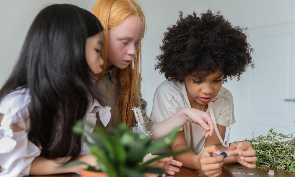 girls looking at plants