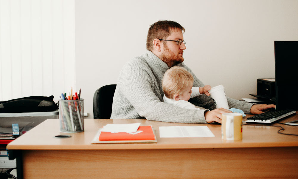 man talking to son while on computer