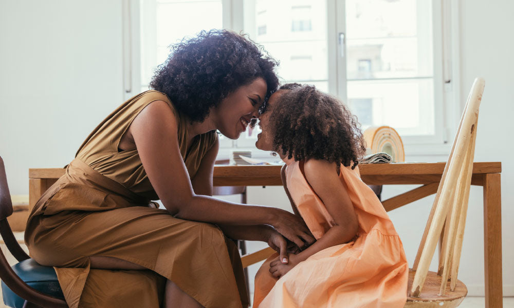 mother and daughter at kitchen table