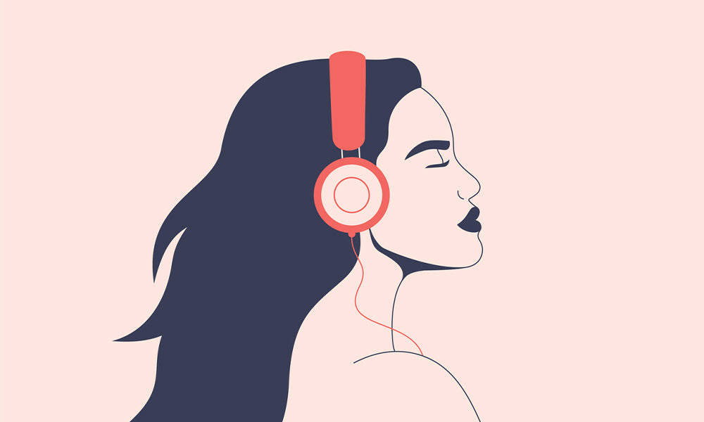 woman listens to music with headphones