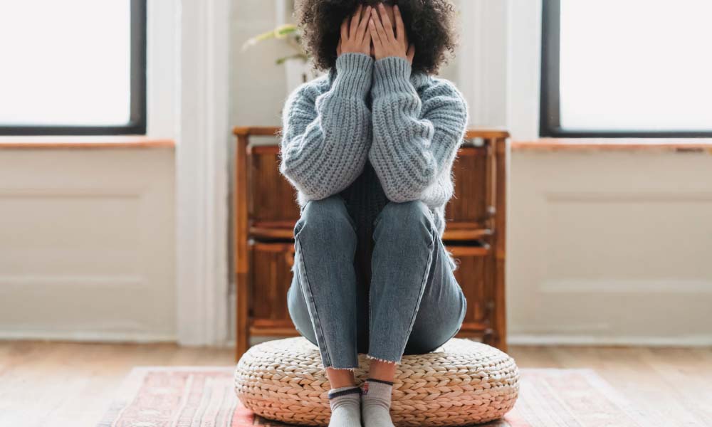 woman sitting looing sad