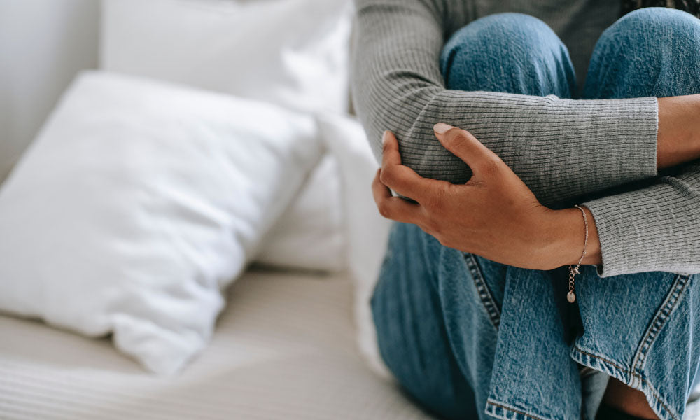 woman sitting on bed